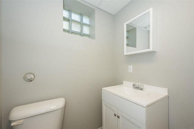 bathroom with toilet and vanity