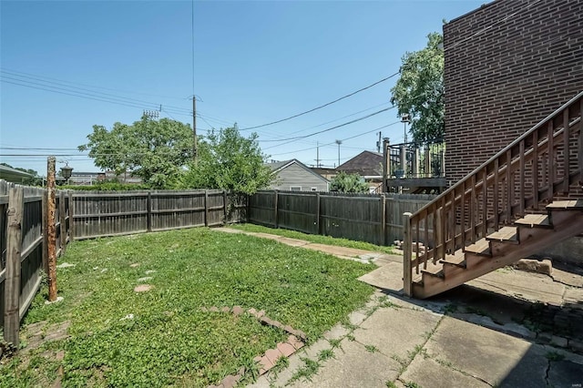 view of yard with a fenced backyard