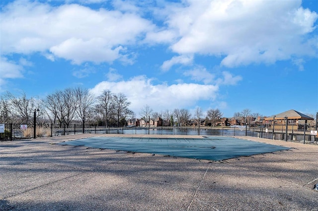 pool featuring a patio and fence