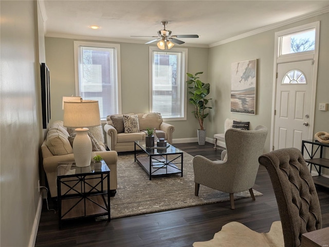 living area featuring wood finished floors, a ceiling fan, baseboards, and ornamental molding