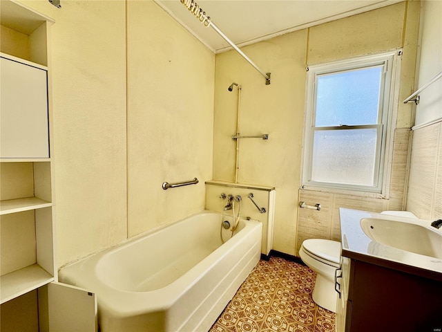 bathroom with vanity, shower / tub combination, toilet, and baseboards