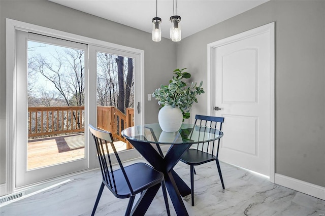 dining room with visible vents, baseboards, and marble finish floor