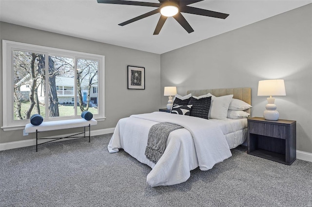 carpeted bedroom featuring baseboards and ceiling fan