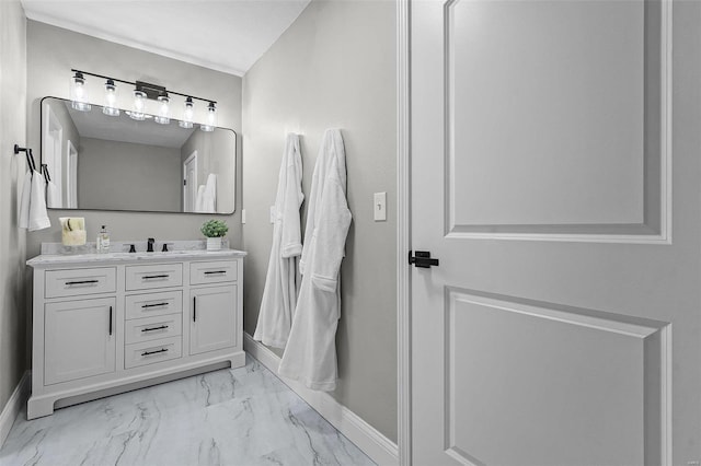 bathroom featuring vanity, baseboards, and marble finish floor