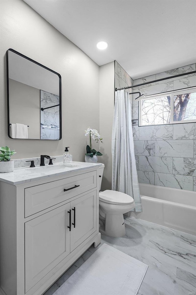 full bathroom featuring toilet, recessed lighting, shower / tub combo, marble finish floor, and vanity