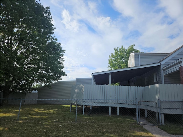 view of yard featuring fence and a wooden deck