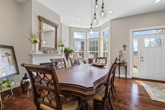 dining room featuring hardwood / wood-style floors, recessed lighting, and baseboards