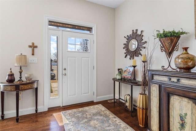 foyer entrance with hardwood / wood-style floors and baseboards