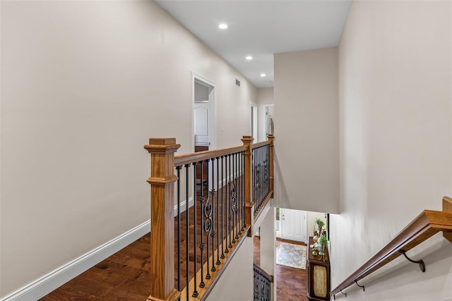 stairs featuring recessed lighting, wood finished floors, and baseboards