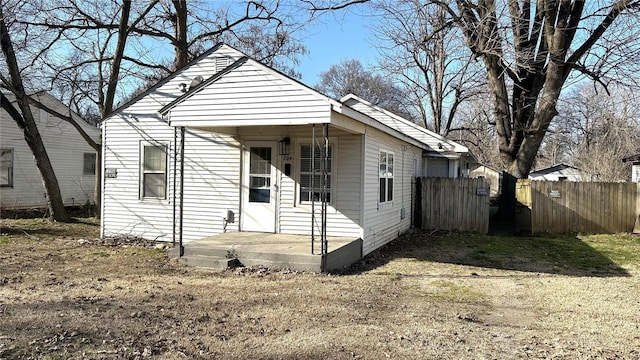 view of front of house featuring fence