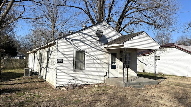 view of front facade with cooling unit and fence