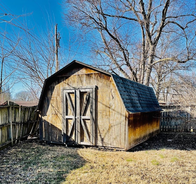 view of shed with fence