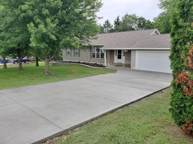 ranch-style house with a front lawn, an attached garage, concrete driveway, and roof with shingles