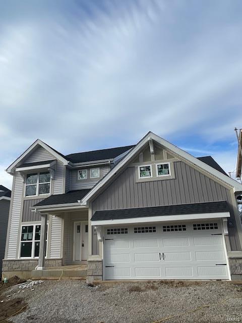 view of front of property with a garage and covered porch