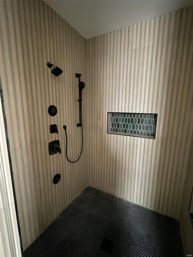 bathroom with a tile shower
