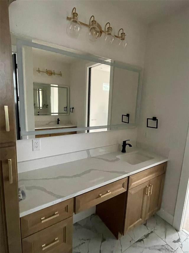 bathroom featuring marble finish floor and vanity