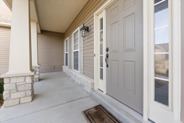 doorway to property with covered porch