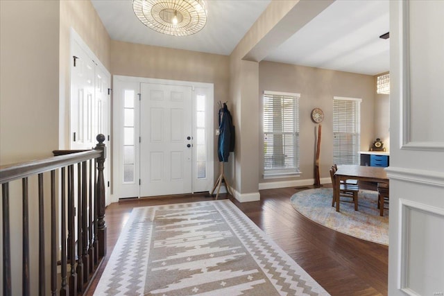 entryway featuring dark wood finished floors and baseboards