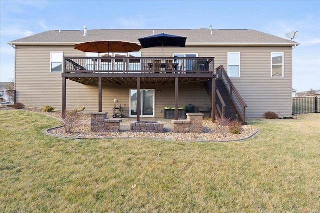 back of property featuring a lawn, a patio, fence, stairway, and a wooden deck