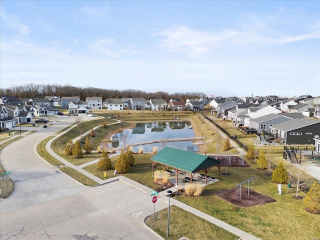 bird's eye view with a residential view and a water view