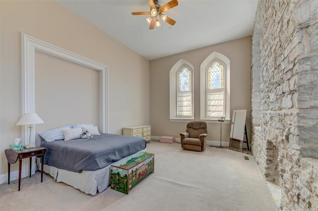 bedroom featuring baseboards, a ceiling fan, and carpet flooring