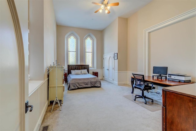 bedroom with visible vents and light carpet