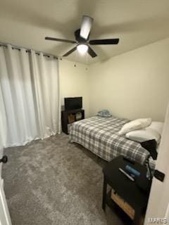 bedroom with a ceiling fan and carpet floors