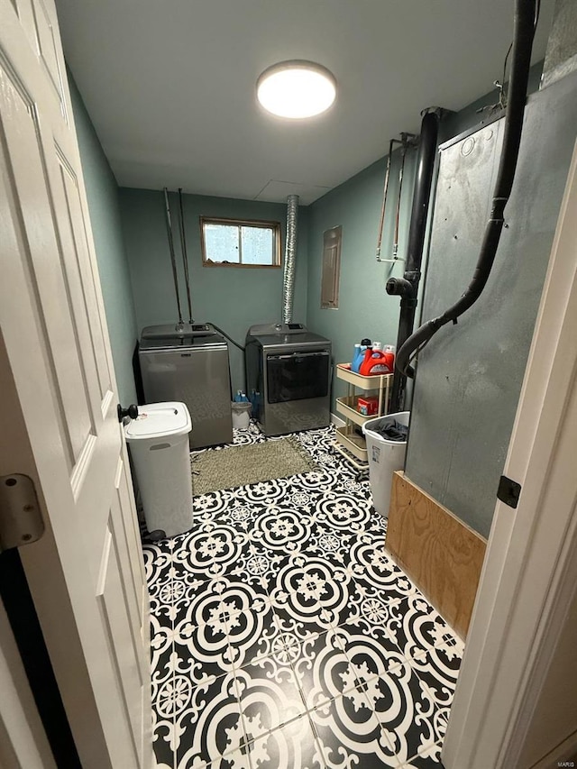 interior space featuring tile patterned floors and independent washer and dryer