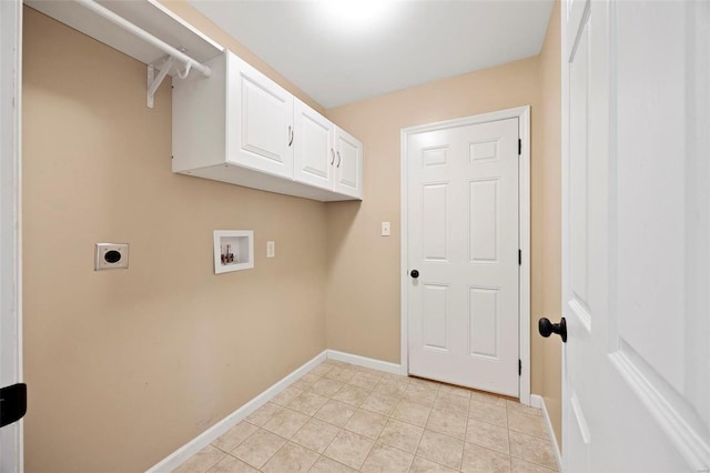 clothes washing area featuring cabinet space, light tile patterned flooring, baseboards, hookup for an electric dryer, and hookup for a washing machine