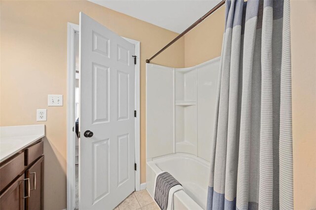 full bathroom featuring tile patterned flooring, shower / bath combination with curtain, and vanity