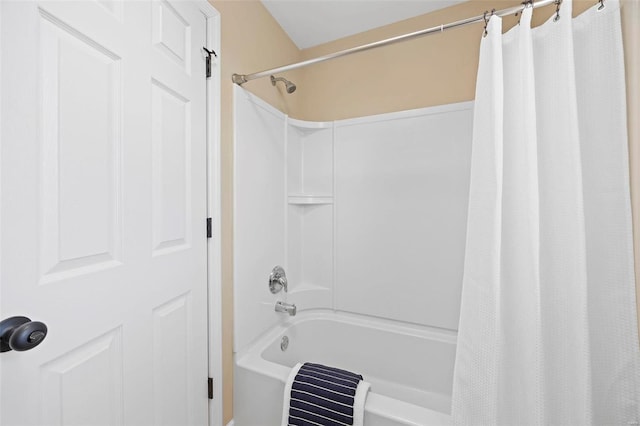 bathroom featuring shower / bath combo with shower curtain