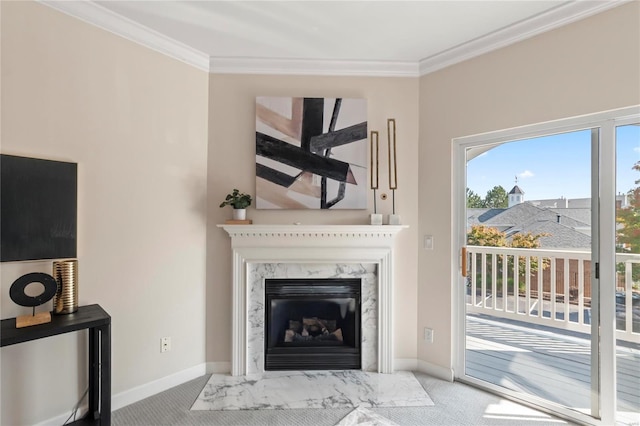 living room with carpet flooring, baseboards, a high end fireplace, and ornamental molding