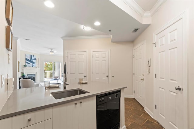 kitchen featuring a sink, open floor plan, a fireplace, crown molding, and dishwasher