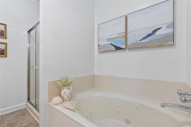 bathroom with tile patterned flooring, a stall shower, and a whirlpool tub