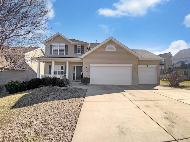 traditional-style home with a garage, covered porch, and concrete driveway