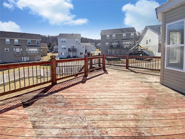 wooden deck featuring a residential view