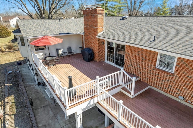 wooden deck featuring area for grilling