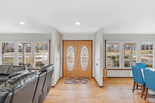 foyer featuring recessed lighting, visible vents, baseboards, and light wood finished floors