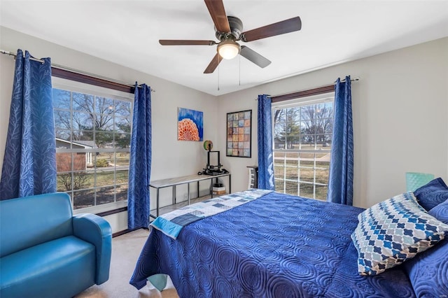 carpeted bedroom featuring a ceiling fan