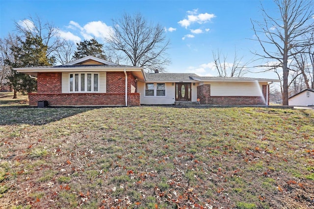 ranch-style house with brick siding and a front yard