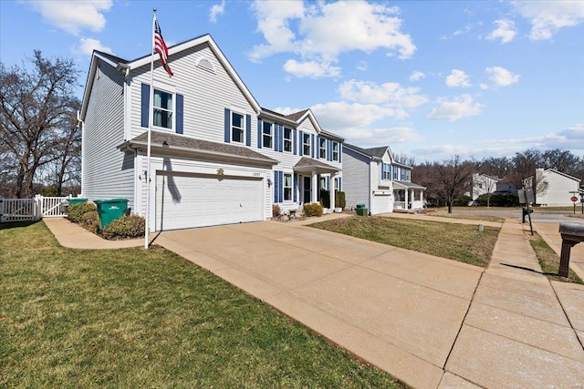 view of front facade featuring an attached garage, concrete driveway, a front yard, and fence