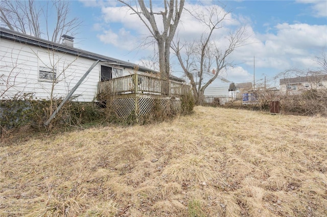 view of yard featuring a wooden deck