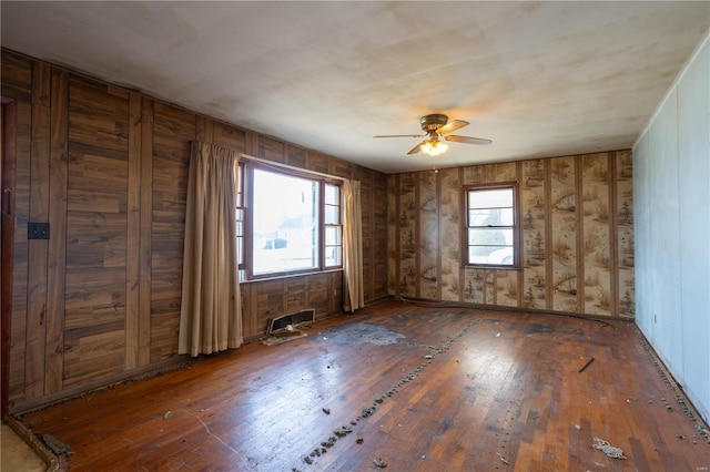 unfurnished room featuring a ceiling fan and wood-type flooring