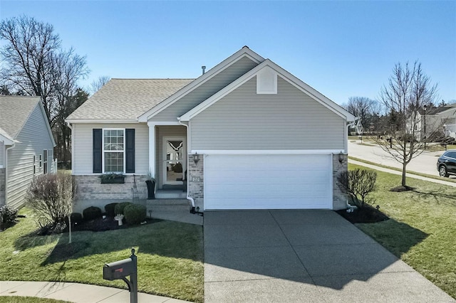 view of front of property featuring a front lawn, concrete driveway, a garage, and a shingled roof