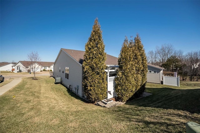 view of property exterior with a yard