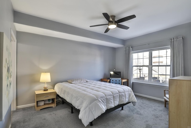 carpeted bedroom with baseboards and ceiling fan