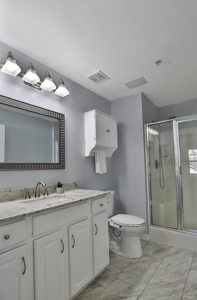 full bathroom featuring vanity, visible vents, a shower stall, toilet, and marble finish floor