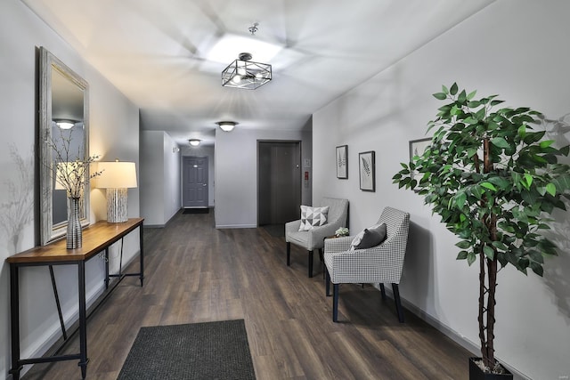 hallway with baseboards and wood finished floors