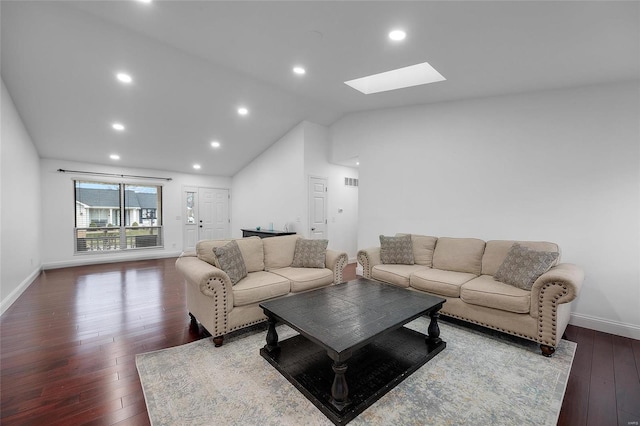 living area with visible vents, lofted ceiling with skylight, recessed lighting, wood-type flooring, and baseboards