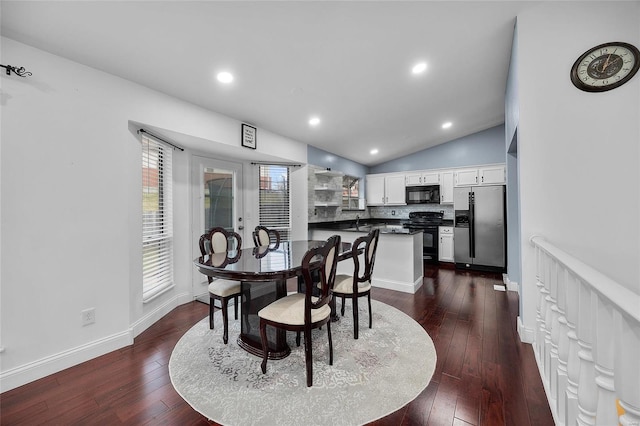 dining room with dark wood finished floors, recessed lighting, baseboards, and vaulted ceiling